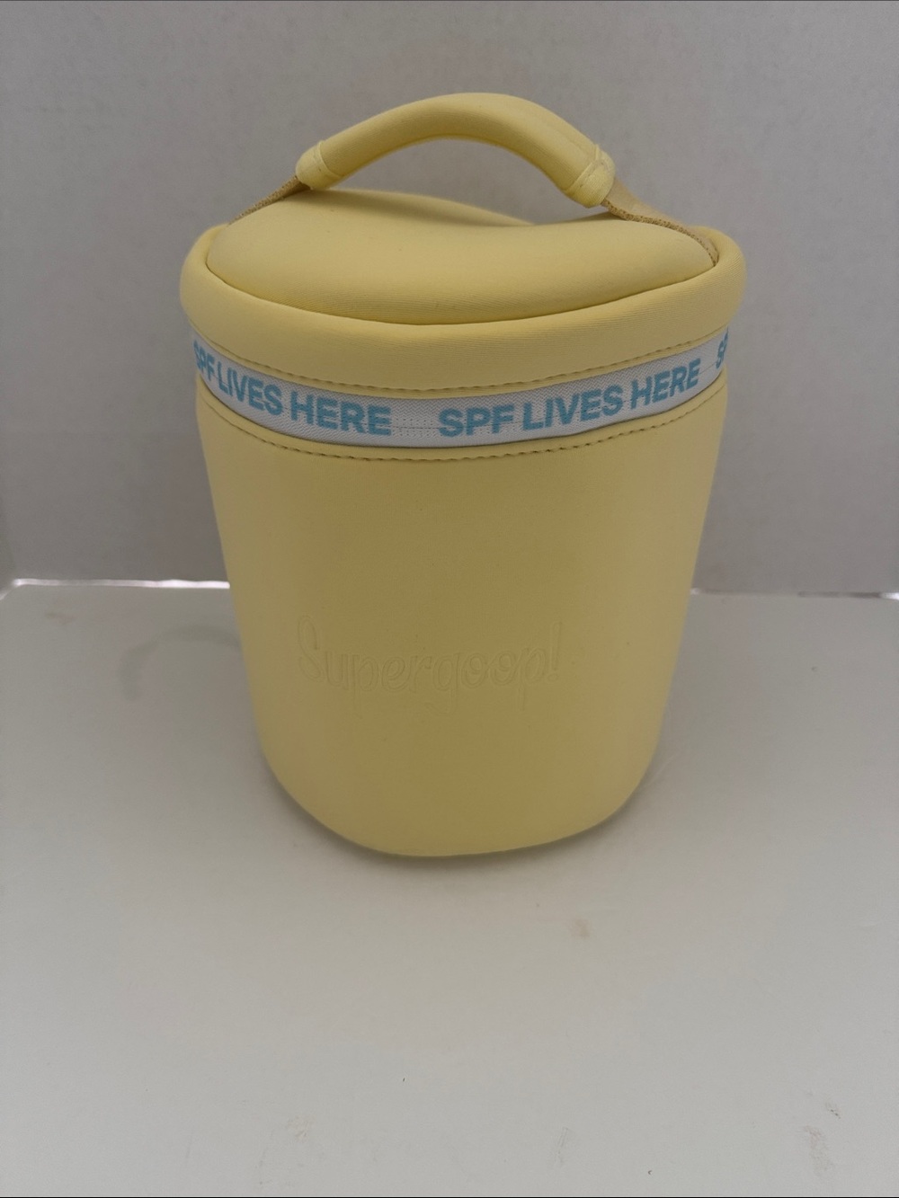 Supergoop! Pale Yellow Neoprene Sunscreen Pouch with Blue Accent - Picture 2 of 5